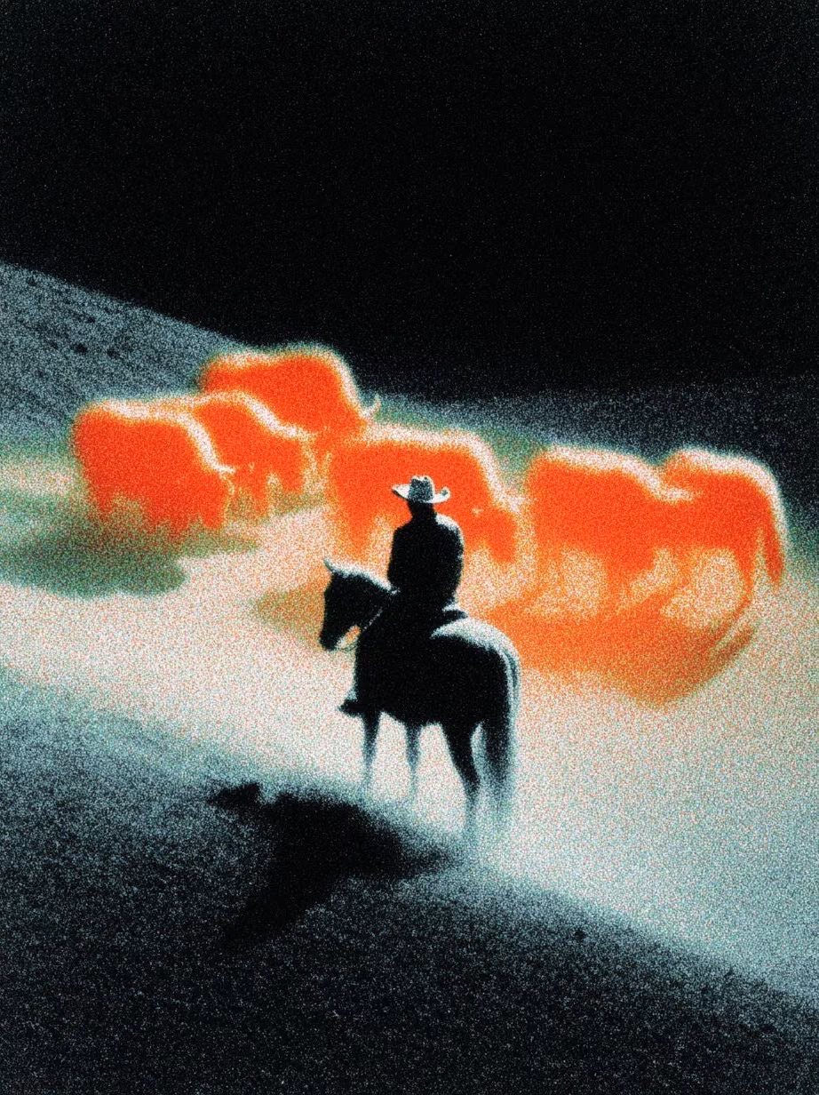 A rider on a hillside, the horses ahead of him glowing orange